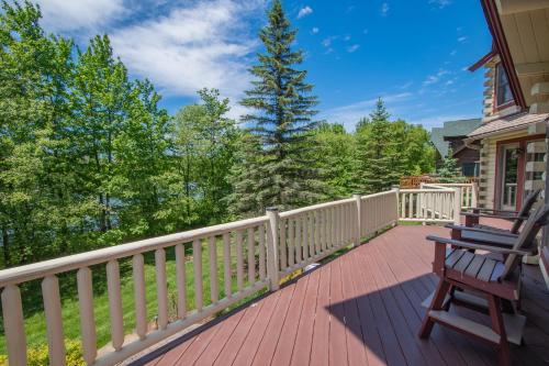a wooden deck with a bench on a house at Mallard Landing in McHenry