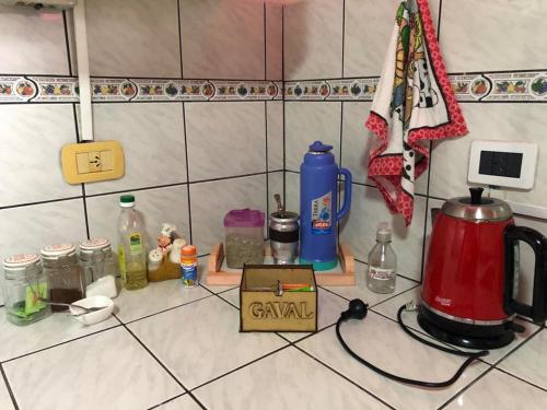 a kitchen counter with a tea kettle and other items at GaVal Apart A in Posadas