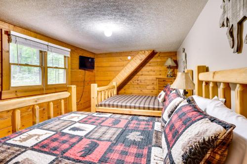 a bedroom with a bench in a log cabin at Orleans Retreat with Private Hot Tub and Fireplace! 