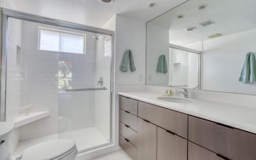 a bathroom with a shower and a toilet and a sink at PS674 - East Island - Meredith Lodging in Palm Desert