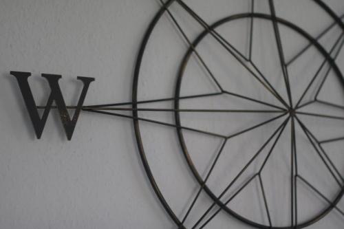 a clock on a wall with the word viii at Modern 3 Double Bedroom Town Centre Maisonette in Morecambe