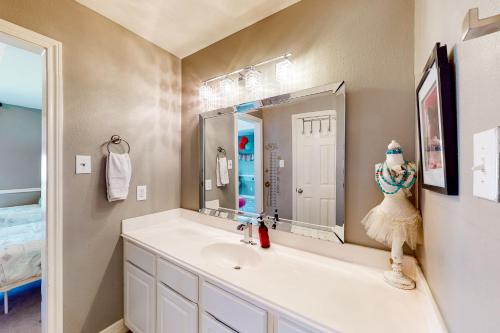 a bathroom with a sink and a mirror at Family-Friendly City Living in Houston