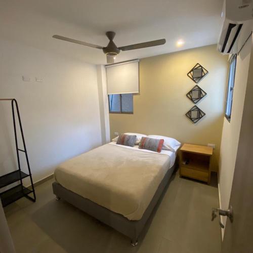 Krevet ili kreveti u jedinici u okviru objekta Aparta Suites Balcones de la Sierra