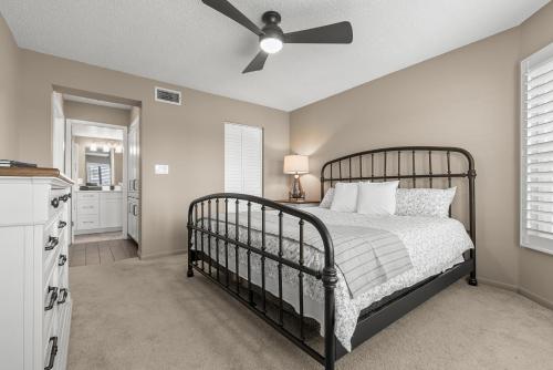 a bedroom with a bed and a ceiling fan at Newly Updated St. Pete 2-BR Condo on Isla Del Sol in St Petersburg