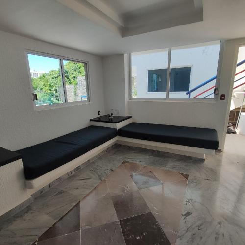 Posezení v ubytování Secretos del Sol Acapulco villas a 5 minutosdel mar