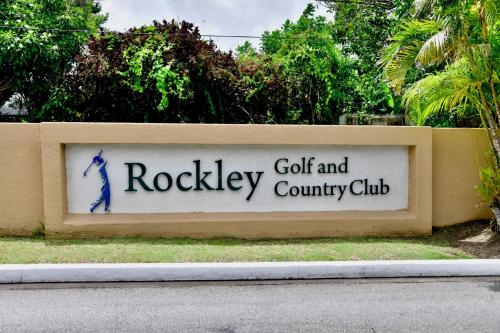 a sign for the rockley golf and country club at 316 Moonshine in Bridgetown