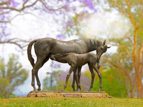 a statue of a horse and a baby horse at Belmore Hotel Scone in Scone