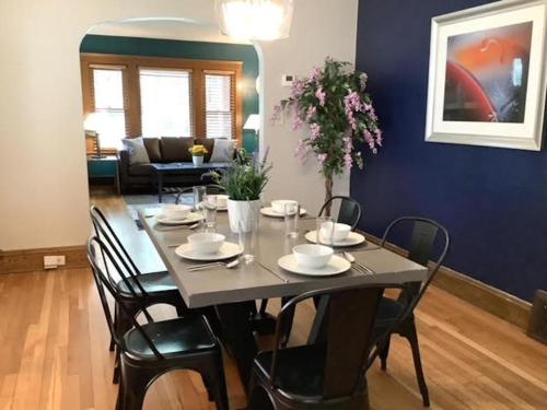 a dining room with a table and chairs at The House Hotels - Cohasset Lower in Lakewood