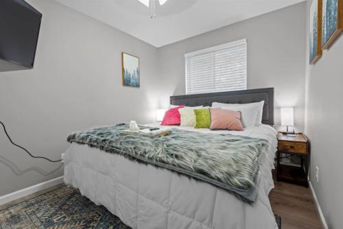 a bedroom with a large bed with at 2 Bed Townhome Saint Charles in Earth City