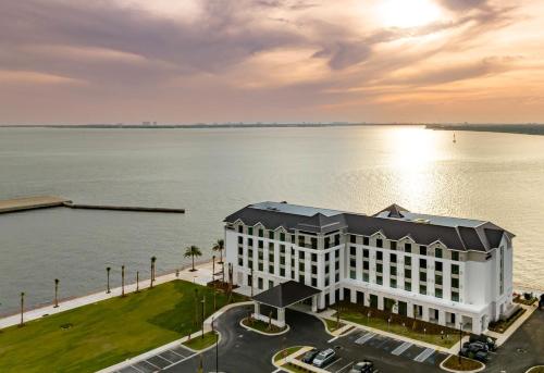 an aerial view of a building next to the water at Hotel Indigo - Panama City Marina by IHG in Panama City