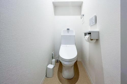 a bathroom with a white toilet in a stall at aLATO Kinshicho in Tokyo