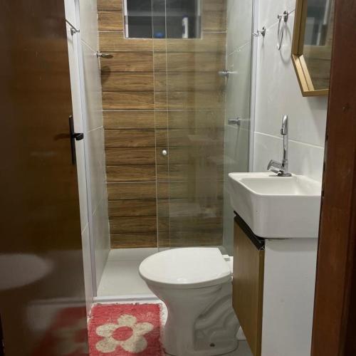 a small bathroom with a toilet and a sink at Rsolmar2023 in Tamandaré