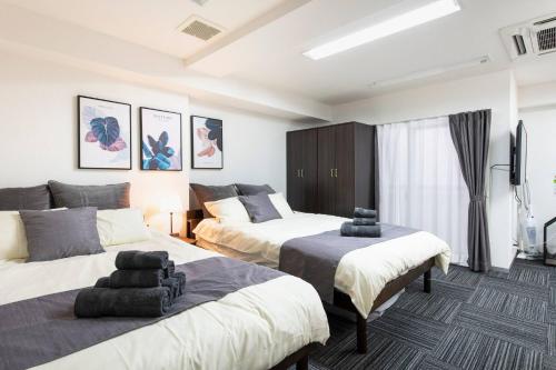 Кровать или кровати в номере Tsukimura Building
