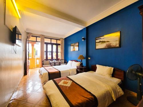 Postel nebo postele na pokoji v ubytování Nguyễn Hùng Hotel Sapa