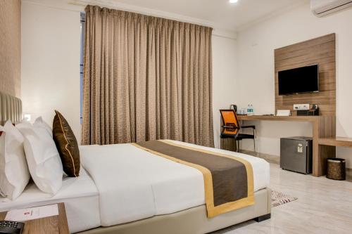 Katil atau katil-katil dalam bilik di Hotel Sterling Inn Bangalore International Airport