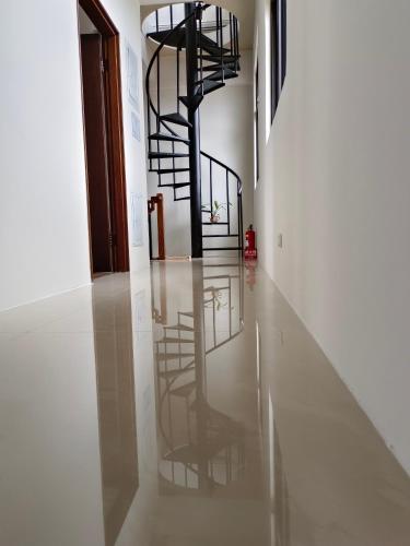 a hallway with a spiral staircase in a building at 日日和 in Tainan