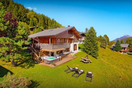 an aerial view of a house on a hill at Chalet Batieu - OVO Network in La Clusaz