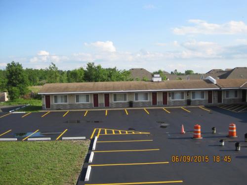 a parking lot in front of a building at Driftwood Motel in Niagara Falls
