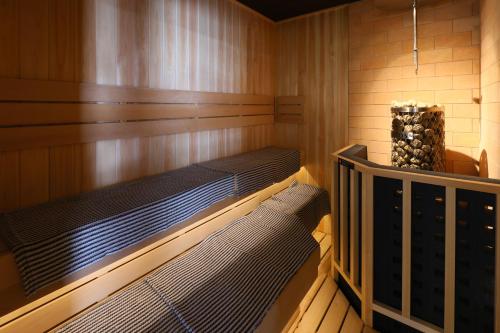 a sauna with two bunk beds in a room at Dormy Inn Kanazawa Natural Hot Spring in Kanazawa