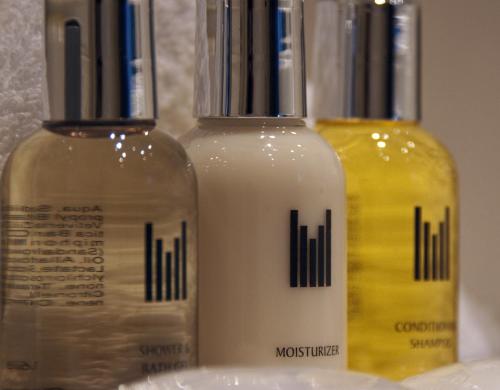 two bottles of moisturizers sitting next to each other at Millennium Hotel & Resort Manuels Taupo in Taupo