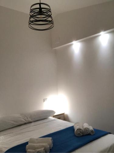 a bedroom with a bed with two towels on it at Stella d'Aurora waterview in Belmonte Calabro