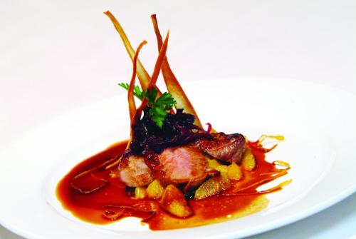 a plate of food on a white plate at Millennium Hotel & Resort Manuels Taupo in Taupo