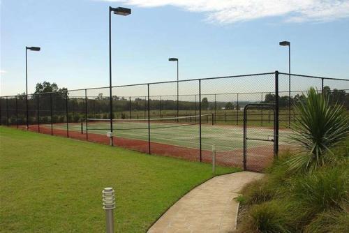 a tennis court with two tennis courts at Excellent campsite Hunter Valley in Pokolbin