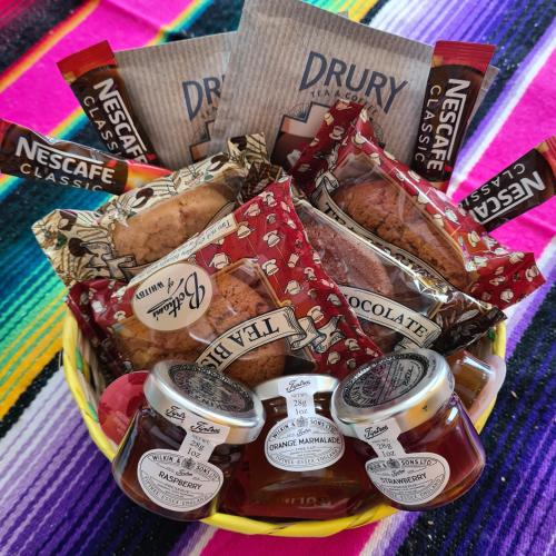 a basket filled with different types of food at Frida's Cottage Whitby in Whitby