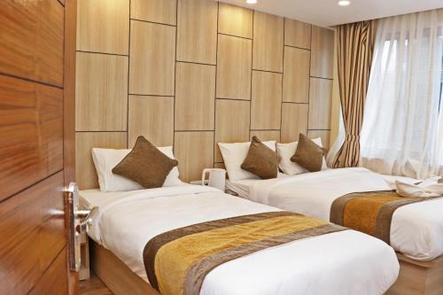 Posteľ alebo postele v izbe v ubytovaní Hotel Airport Gurkha