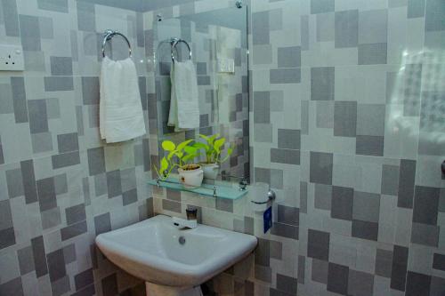 Kúpeľňa v ubytovaní Sigiri Enaya Cottage