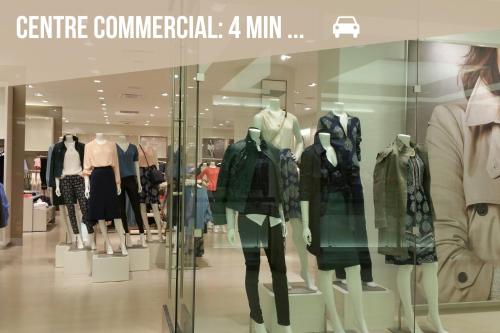 a store window with a bunch of mannequins at Le Green Duplex - Clim - Parking - Netflix - Nestor & Margot in Auterive