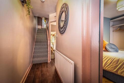 a small hallway with a bed and a stairway at City Escape Waterford City Sleeps 6 in Waterford