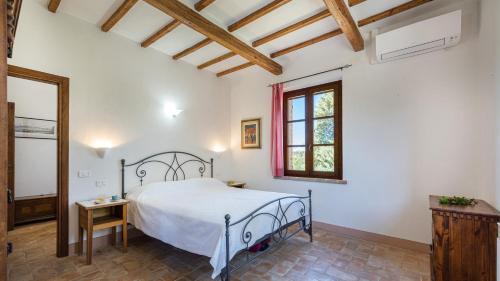 a bedroom with a bed and a window at CASA EUSEBIA 8&2, Emma Villas in Città della Pieve
