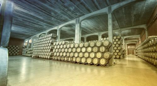 a large room with a bunch of barrels in it at La Posada de Pradorey in Ventosilla