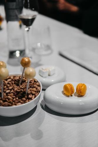 two plates of food with mushrooms on a table at J44 Lifestyle Hotel in Lido di Jesolo