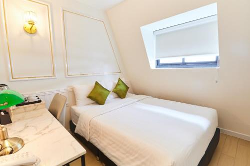 Rose Apple Hotelにあるベッド