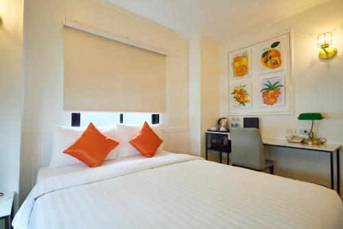 Rose Apple Hotelにあるベッド