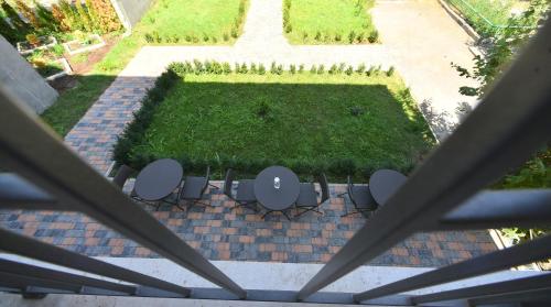 an aerial view of a garden with chairs and a table at Hotel Avenue 30 in Yerevan