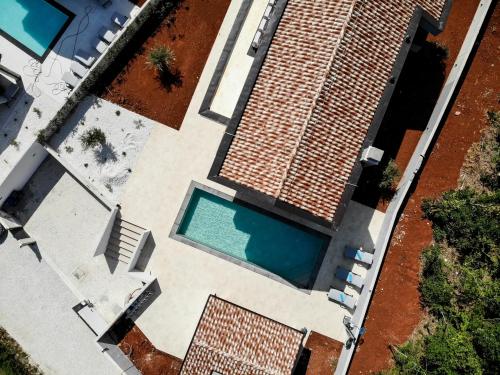an overhead view of a swimming pool next to a house at Villa Istra Relax Diamond in Rebići