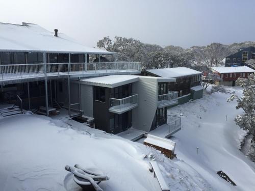 a large building with a ski lift on top of it at Mountain Dreaming in Mount Hotham