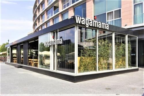 a store front of a building with glass windows at Prestigious SKY PARK apartment - top city view - Traveller awards 2024 in Bratislava