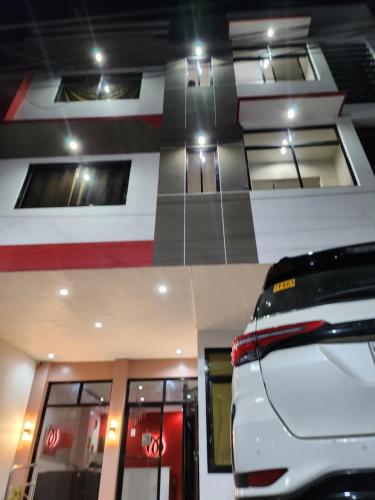 a car parked in front of a building at Mantra Pensionne Superior Room in Cagayan de Oro