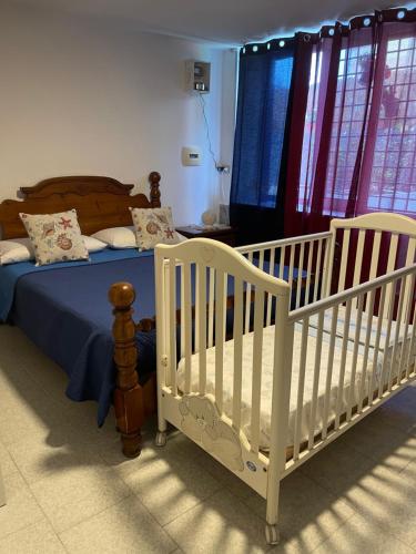 Postel nebo postele na pokoji v ubytování La Villa Carmela Cuma