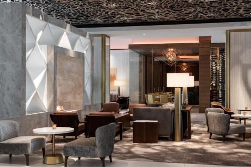 a lobby of a hotel with chairs and tables at The Westin Anaheim Resort in Anaheim