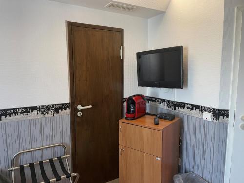 TV a/nebo společenská místnost v ubytování Hotel Corsten