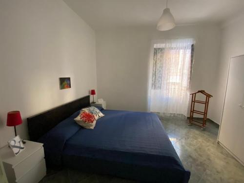 Ένα ή περισσότερα κρεβάτια σε δωμάτιο στο Dimora Zefiro vacanze