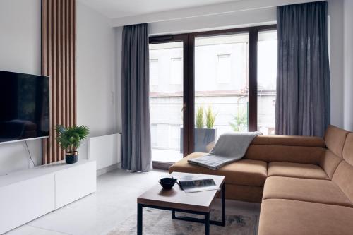Μια τηλεόραση ή/και κέντρο ψυχαγωγίας στο Apartamenty In Belnihel