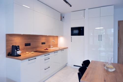 Η κουζίνα ή μικρή κουζίνα στο Apartamenty In Belnihel