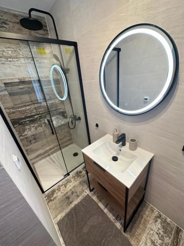 a bathroom with a sink and a mirror at Osada Barbanica in Szczyrk