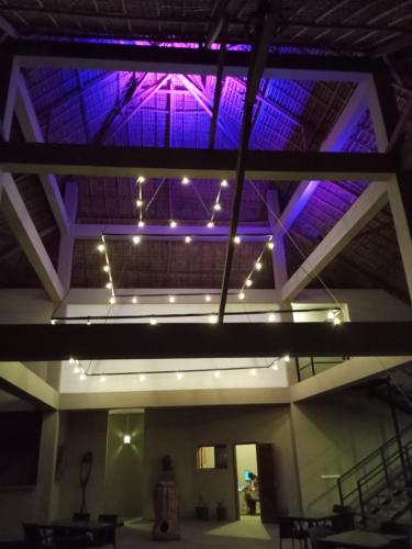 a ceiling with purple lights in a building at MAISON CARREE in Andilana